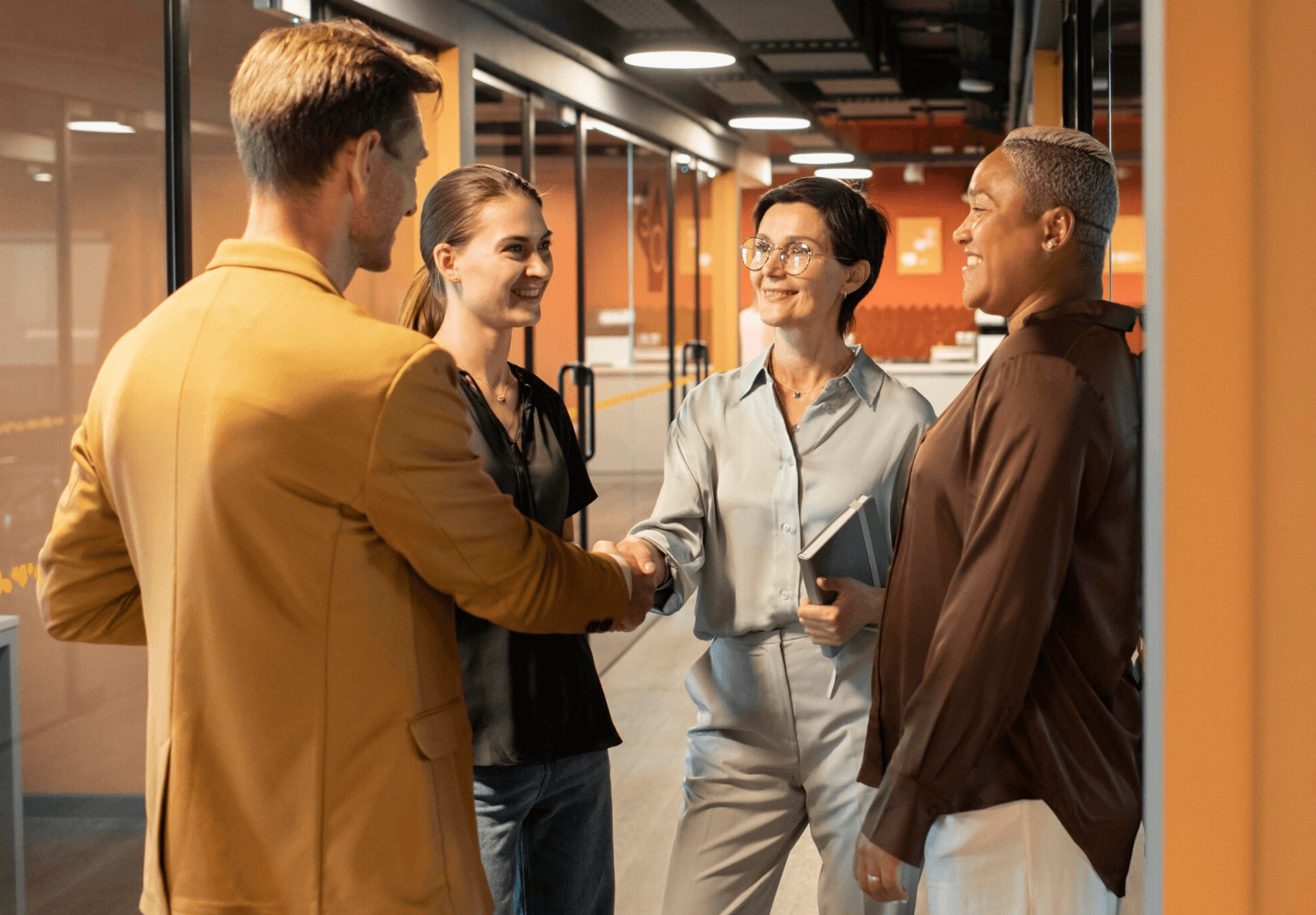Diverse team of professionals collaborating in a modern office, representing PoraDoor partnership and trust.